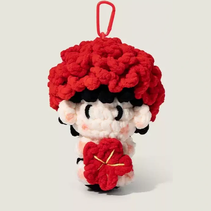 Crochet Character Bag Charm on a simple low-saturation background