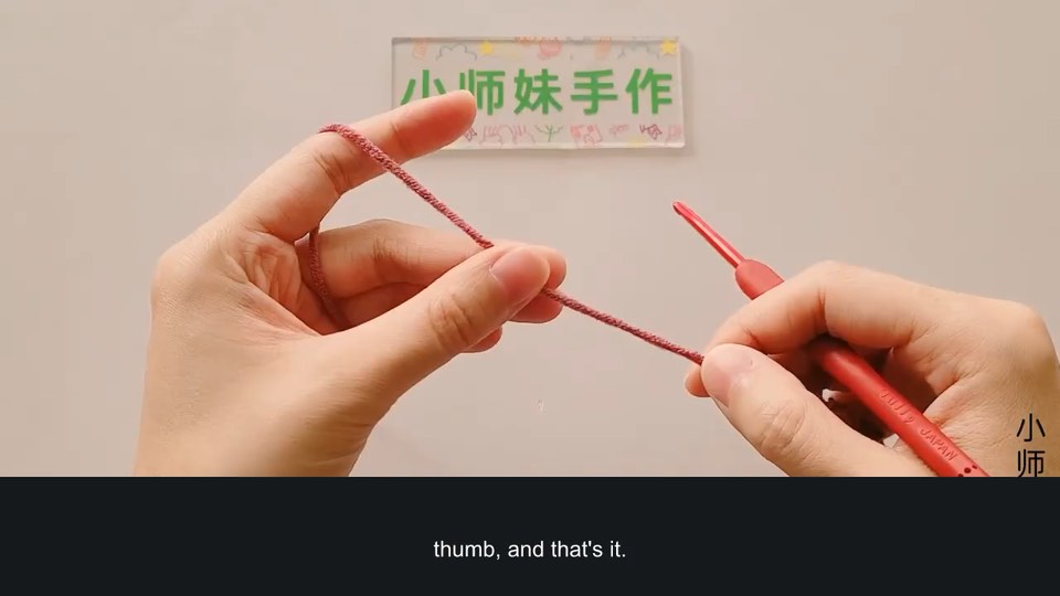 Holding the yarn and hook comfortably — tutorial video frame