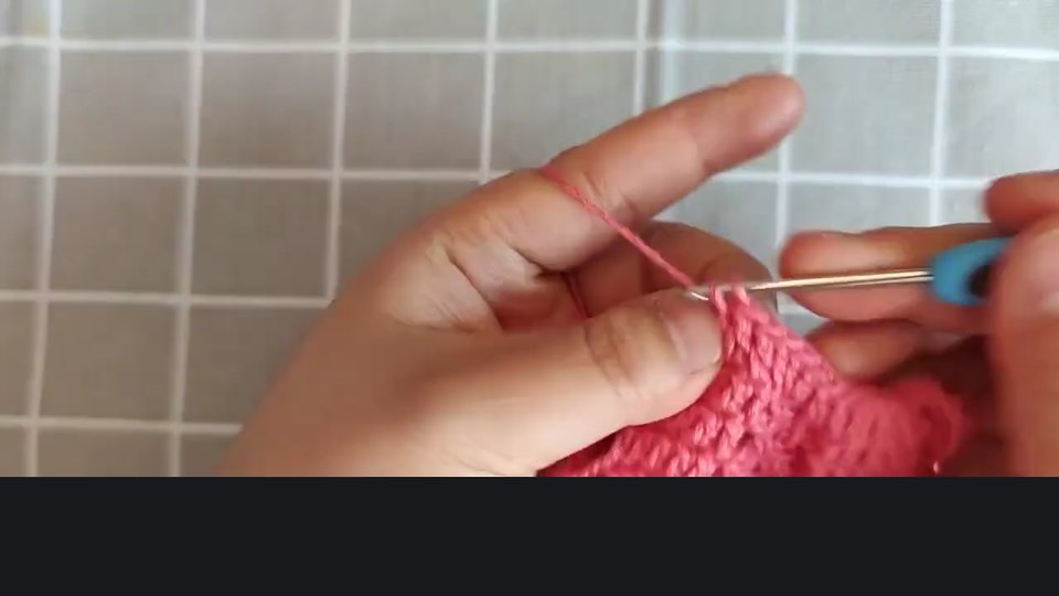 Pineapple-stitch sweater — front neckline — tutorial video frame