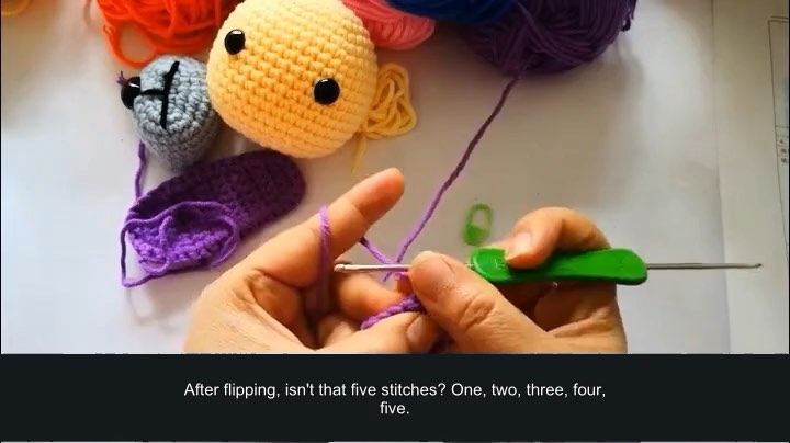 Rainbow puppy amigurumi — ear assembly — tutorial video frame