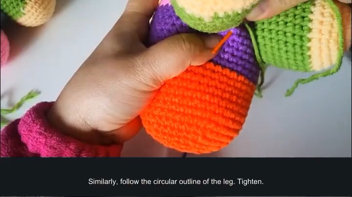Rainbow puppy amigurumi — leg seams — tutorial video frame